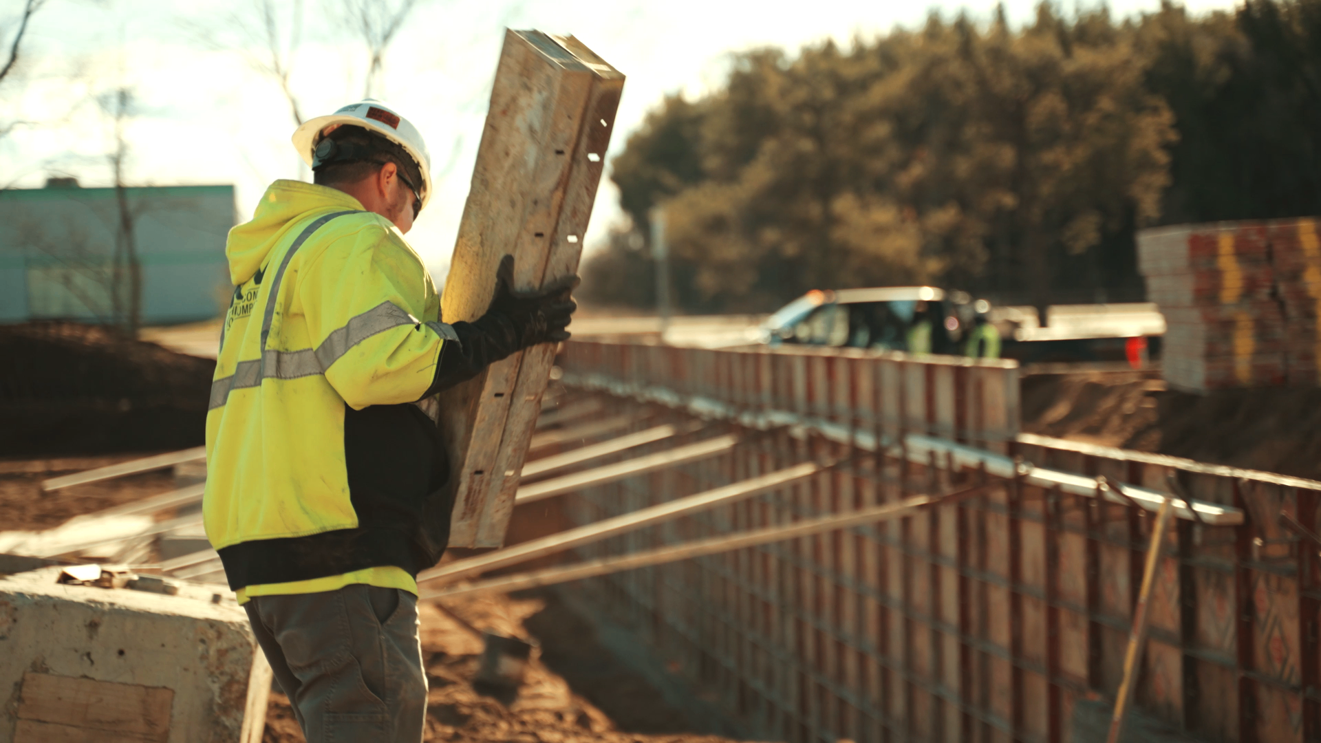 Concrete contractor reviewing project plans on a job site
